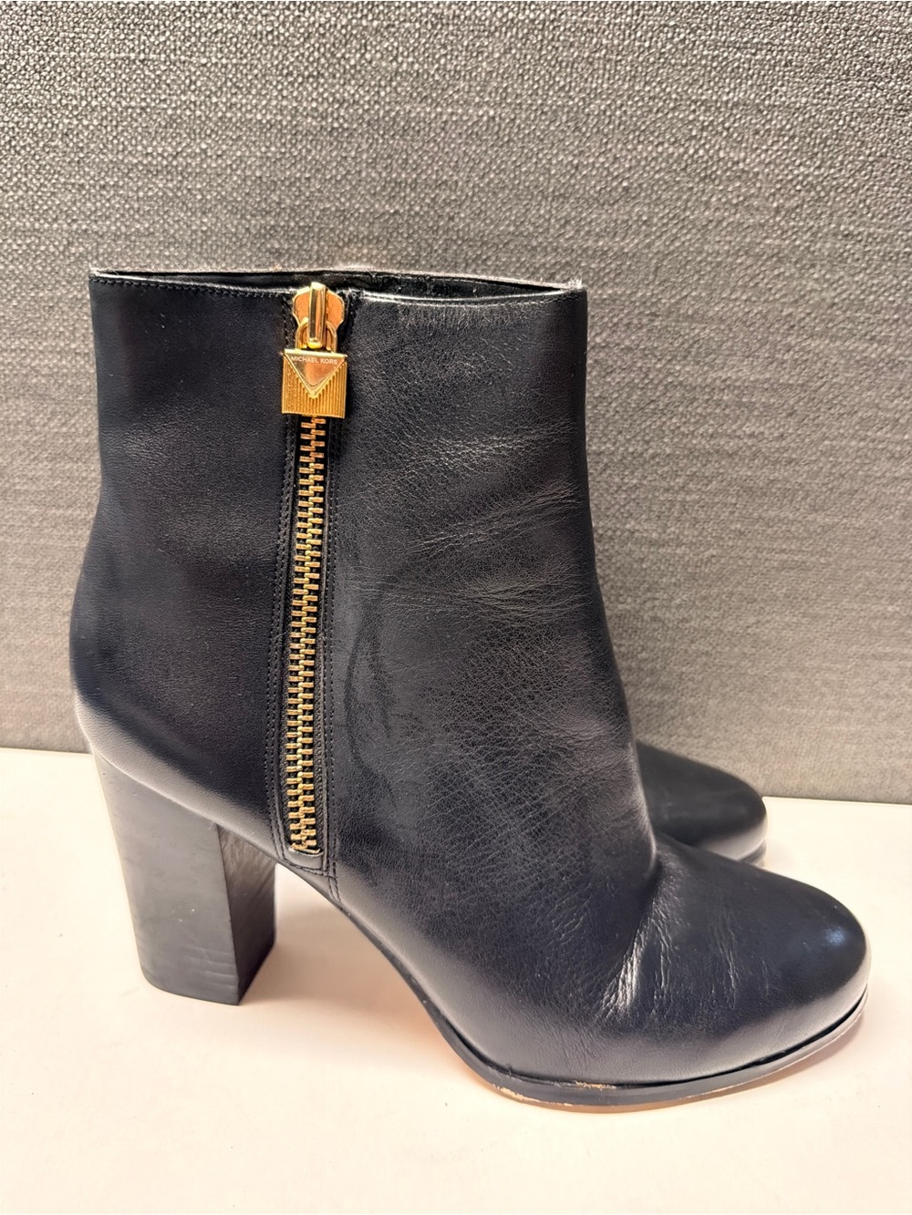 MICHAEL Michael Kors Black Leather Ankle Boot with Gold Side Zip
